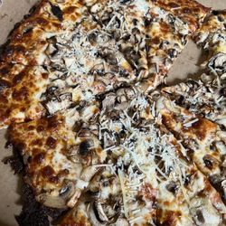 Mushroom pizza (ate a slice) too hungry then I remembered take a picture