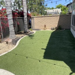 a small backyard with artificial grass a small backyard with artificial grass