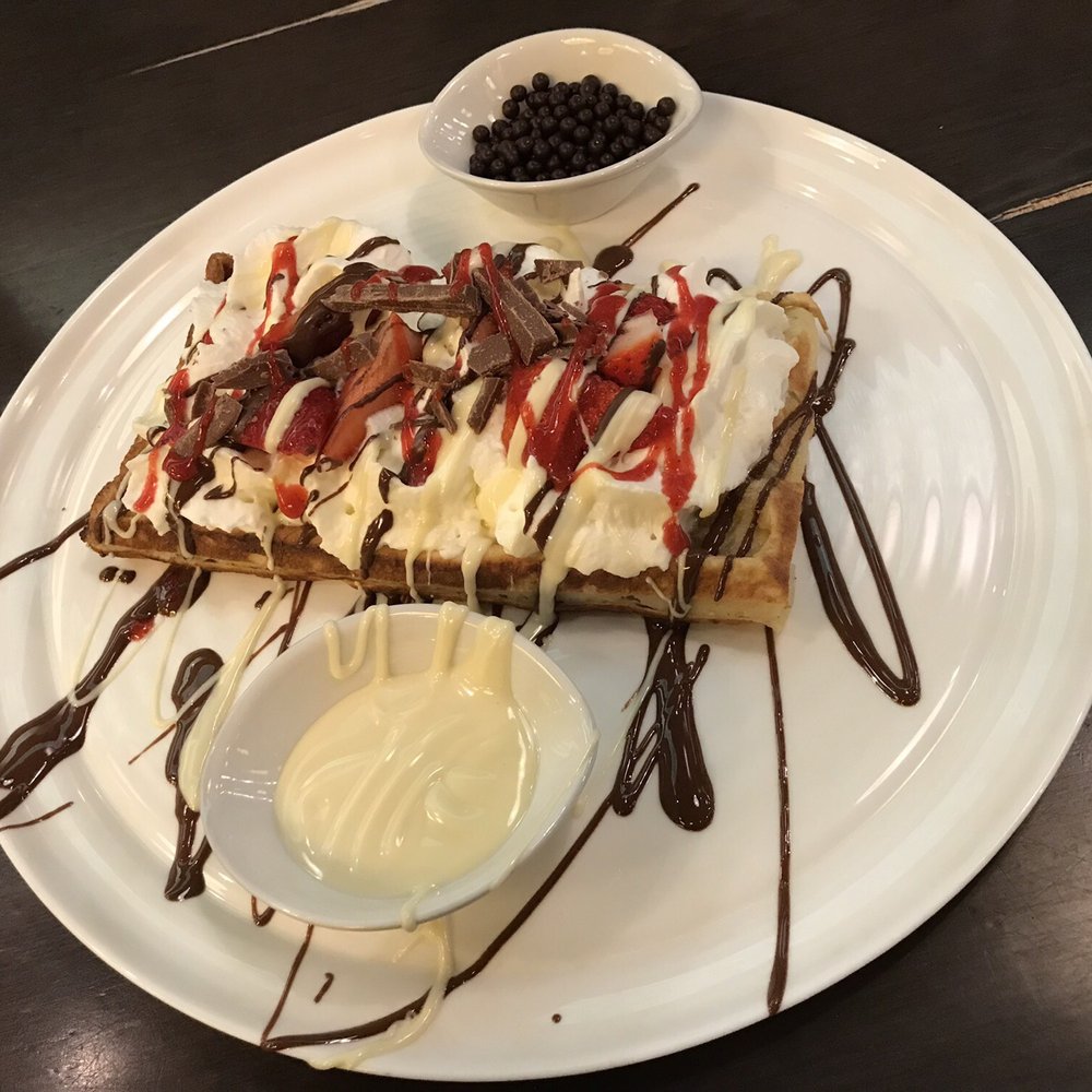 Cacao 70 - After-Party Waffle: strawberries, whipped cream, milk chocolate, white chocolate, homemade berry sauce & chocolate crunchies. - Desserts Near Me - Montreal, Quebec Cacao 70 - After-Party Waffle: strawberries, whipped cream, milk chocolate, white chocolate, homemade berry sauce & chocolate crunchies. - Desserts Near Me - Montreal, Quebec