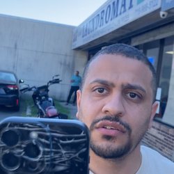 Island Laundromat - After I left the laundromat, the manager followed me outside and began recording me at close range, holding his phone near my face.