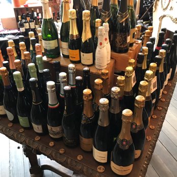 D.O.C. Wine Shop - a table full of wine bottles - Beer, Wine & Spirits Near Me - Brooklyn, New York