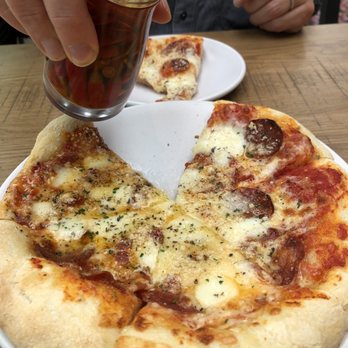 Lincoln Social Rooftop - Diavola pizza with pepper oil drizzle - American Near Me - Columbus, Ohio Lincoln Social Rooftop - Diavola pizza with pepper oil drizzle - American Near Me - Columbus, Ohio