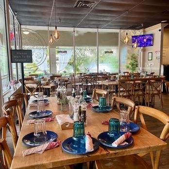 Pizza Lovers Bistro - a dining area with tables and chairs - Pizza Near Me - Plantation, Florida Pizza Lovers Bistro - a dining area with tables and chairs - Pizza Near Me - Plantation, Florida
