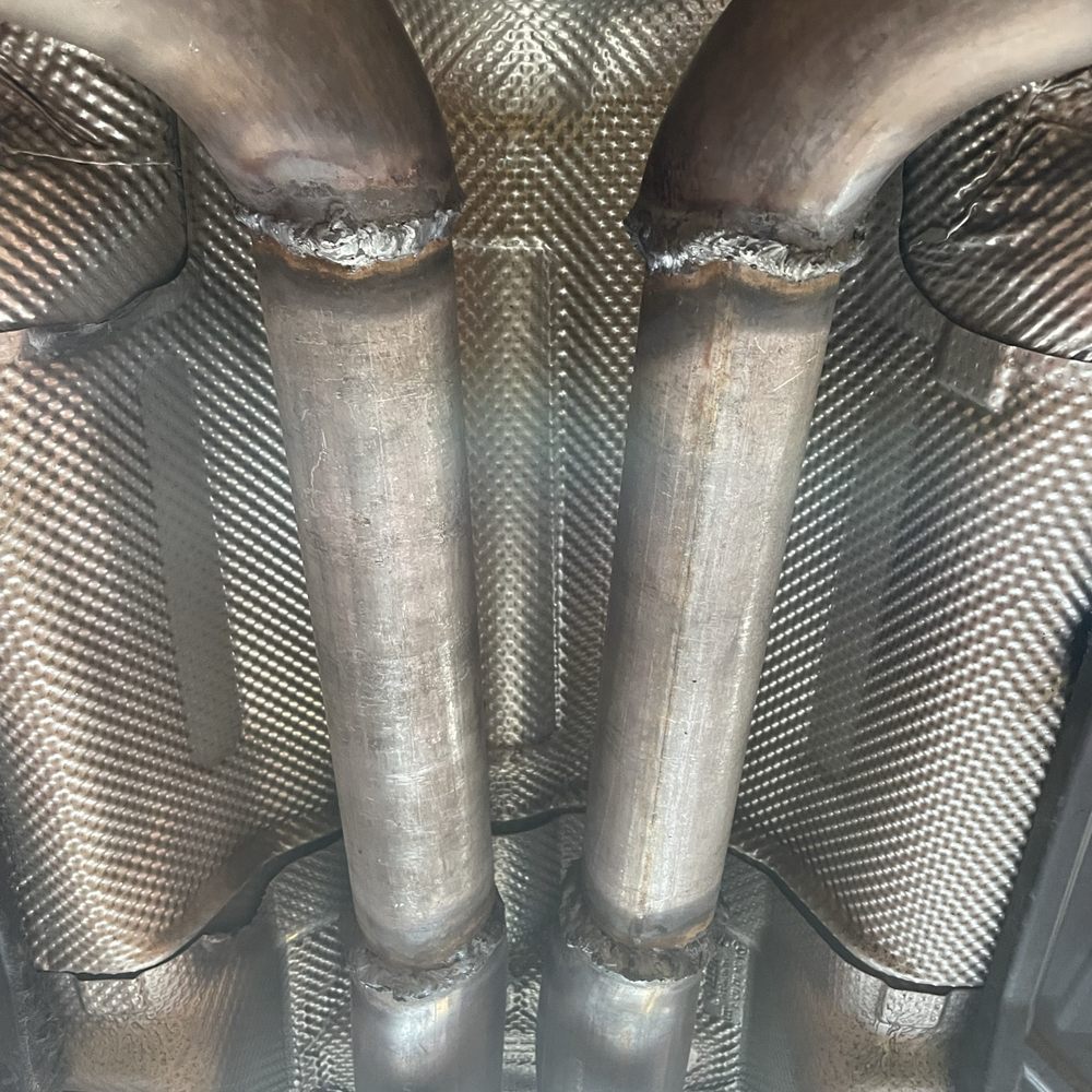 Mobile Mufflers - Result of this business's work. Note the heat damage to the surrounding area, poor quality of exhaust piping, and poor welds. - Auto Repair Near Me Mobile Mufflers - Result of this business's work. Note the heat damage to the surrounding area, poor quality of exhaust piping, and poor welds. - Auto Repair Near Me