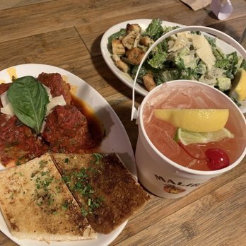 Talarico's Pizzeria - Meatballs,  caesar salad &  Junction juice bucket. So good. - Pizza Near Me - Seattle, Washington
