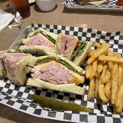 The Palms Grill & Bar - Club sandwich, fries