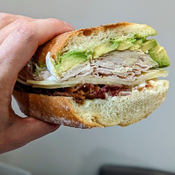 Bagel Pub - June 3, 2022; Turkey, bacon, Swiss cheese, avocado & mayo sandwich on brick oven hero ($17.36). - Breakfast & Brunch Near Me - Brooklyn, New York