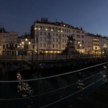 Hotel Savoia & Jolanda - View of hotel from ferry dock (Hotel Savoia & Jolanda is the red building with all the lights) - Hotels Near Me - Venezia, VE Hotel Savoia & Jolanda - View of hotel from ferry dock (Hotel Savoia & Jolanda is the red building with all the lights) - Hotels Near Me - Venezia, VE