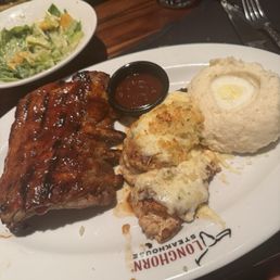 9oz. Parmesan Crusted Chicken with Half-Rack Baby Back Ribs 9oz. Parmesan Crusted Chicken with Half-Rack Baby Back Ribs