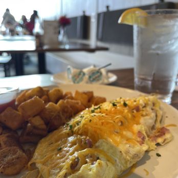 Brick & Spoon - Ham and egg omelet with the shell... are these hash browns? - Breakfast & Brunch Near Me - Gulfport, Mississippi Brick & Spoon - Ham and egg omelet with the shell... are these hash browns? - Breakfast & Brunch Near Me - Gulfport, Mississippi