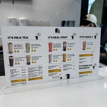 Its Tea - A printed menu board at Its Tea in Toronto lists milk teas, real fruit teas, and yakult drinks with prices and options. - Bubble Tea Near Me - Toronto, Ontario