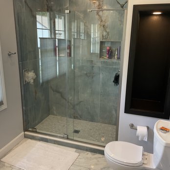 Evergreen Contracting Services - Custom tile work the built in shelve were still awaiting glass shelves this space was just walled over - General Contractors Near Me - Fairfax, Virginia