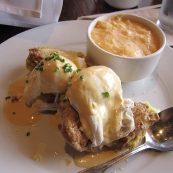 Murphy's - Special poached eggs and pork tenderloin over buttermilk biscuits. Cheddar grits side. - American Near Me - Atlanta, Georgia
