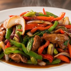 Basil stir-fried with beef at Sawa. Fresh basil, peppers, and onions in a savory sauce. Closed Mondays.