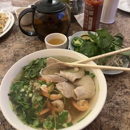 Clear Rice Noodle Soup Topped with Shrimp and Slices of Pork Loin and Jasmine Tea Clear Rice Noodle Soup Topped with Shrimp and Slices of Pork Loin and Jasmine Tea