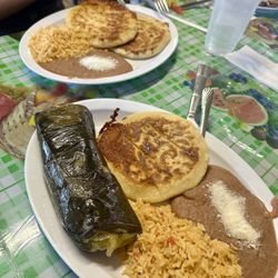 El Amanecer - Tamale plate plus a pupusa and 2 pupusa plate in the back