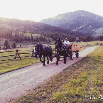 320 Guest Ranch - Horse-drawn wagon returning to pick up diners at the BBQ - Guest Houses Near Me - Gallatin Gateway, Montana