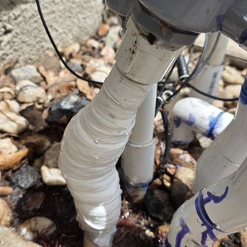 C & C Plumbing Pros - PVC pipe fitting to sprinkler valve wrapped in pressure tape,  broken inside the tape and filled with water. - Plumbing Near Me