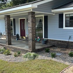 Trawick Gardens & Landscapes - After: The house looks clean and well-maintained.