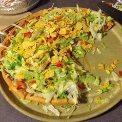 Godfathers Pizza - Taco pizza here is hard to beat. If only they used taco seasoned tortilla chips...
