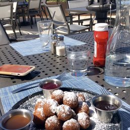 Donut holes with chocolate, raspberry and caramel sauce