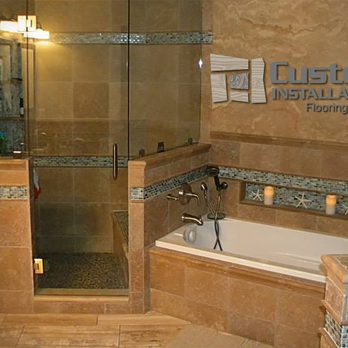 Custom Installations - a bathtub and shower in a bathroom - Flooring Near Me - Silver Lake, Minnesota Custom Installations - a bathtub and shower in a bathroom - Flooring Near Me - Silver Lake, Minnesota