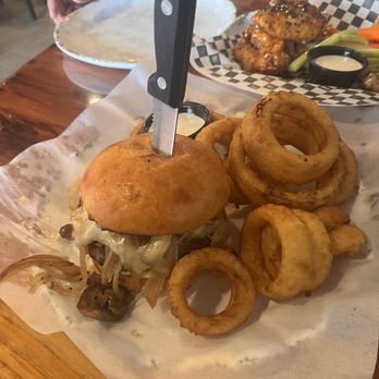 Cold Springs Crossing Bar & Grill - Mushroom Swiss burger with onion rings - Pizza Near Me - Reno, Nevada Cold Springs Crossing Bar & Grill - Mushroom Swiss burger with onion rings - Pizza Near Me - Reno, Nevada