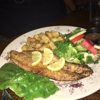 Byblos - Fish dish with batata hara. ( Pengasius) - Mediterranean Near Me - Tampa, Florida
