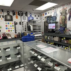 Iron Sights Shooting Range - Another photo behind the counter and selection of targets.