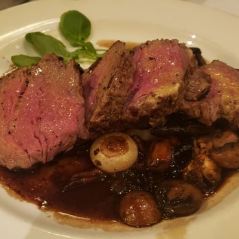 The Capital Grille - Sliced filet Mignon with mushrooms - Steakhouses Near Me - Miami, Florida The Capital Grille - Sliced filet Mignon with mushrooms - Steakhouses Near Me - Miami, Florida