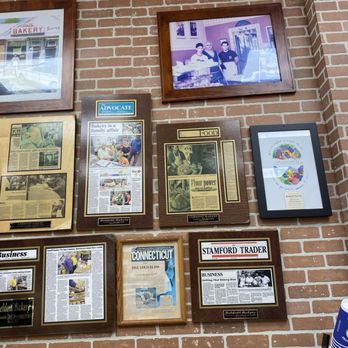 Beldotti Bakery - a brick wall with many framed photos - Bakeries Near Me - Stamford, Connecticut Beldotti Bakery - a brick wall with many framed photos - Bakeries Near Me - Stamford, Connecticut