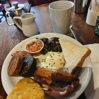 The Hairy Lemon - Full Irish Breakfast. Poached egg, has brown, sausage, back bacon, white and black pudding, toast, beans, grilled tomato and mushrooms - Irish Pub Near Me - Dublin, D The Hairy Lemon - Full Irish Breakfast. Poached egg, has brown, sausage, back bacon, white and black pudding, toast, beans, grilled tomato and mushrooms - Irish Pub Near Me - Dublin, D