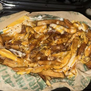 Wingstop - Loaded Louisiana Voodoo Fries: Cajun seasoned fries with house-made ranch & cheese sauce. So good - Chicken Wings Near Me - Las Vegas, Nevada Wingstop - Loaded Louisiana Voodoo Fries: Cajun seasoned fries with house-made ranch & cheese sauce. So good - Chicken Wings Near Me - Las Vegas, Nevada
