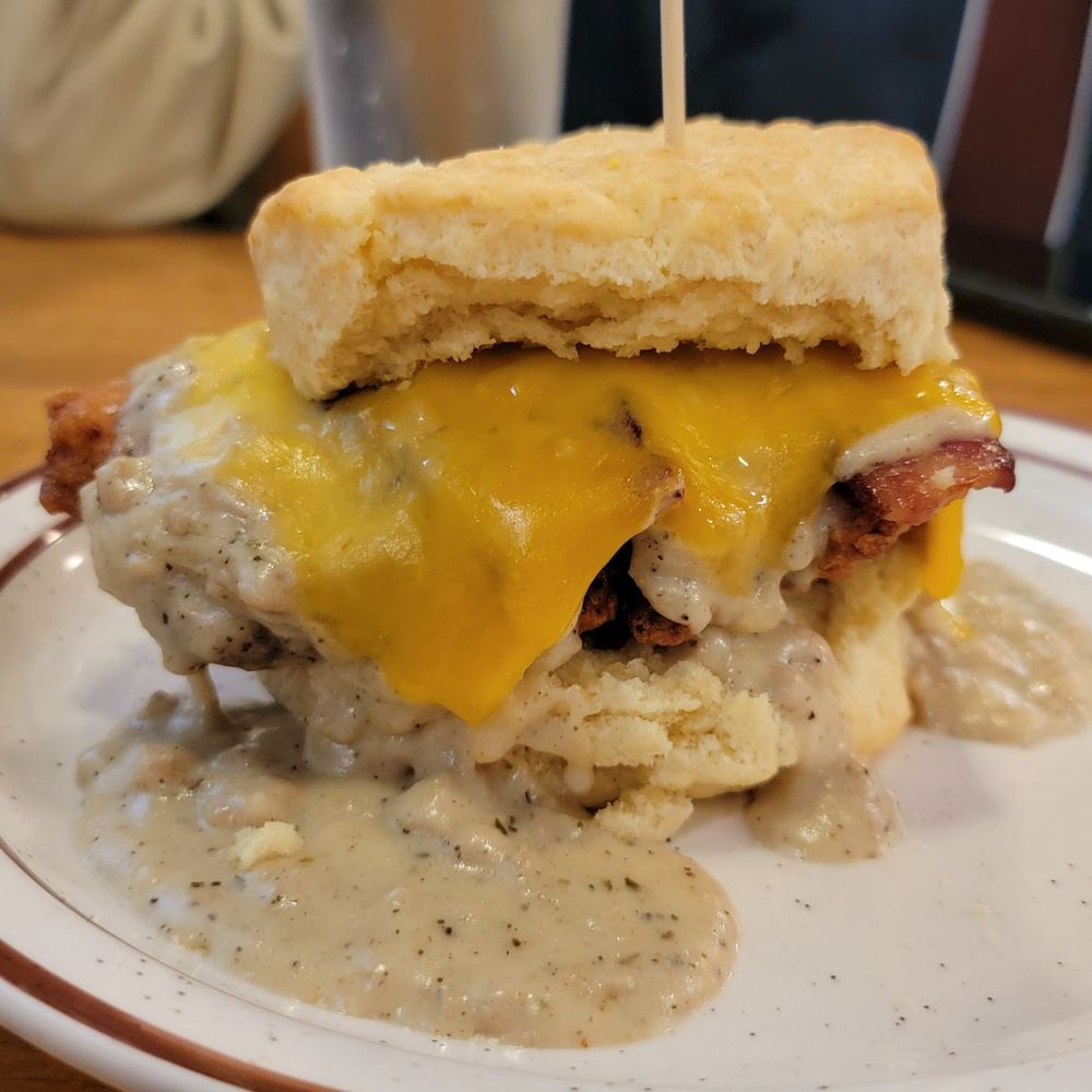 THE REGGIE (Fried chicken, bacon, Tillamook cheddar. Topped with sausage gravy) THE REGGIE (Fried chicken, bacon, Tillamook cheddar. Topped with sausage gravy)