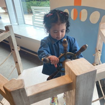 Edamama Cute Cuts & More - Evy pretending to be a captain - Hair Salons Near Me - Brooklyn, New York