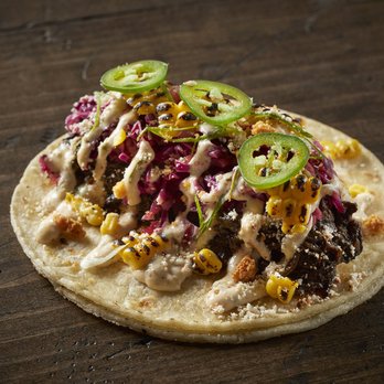 Taco Bamba Shirlington - taco with black chili bbq barbacoa, corn coleslaw, esquites crema, cheese, green onion, jalapeño, crispy onion - Tacos Near Me - Arlington, Virginia Taco Bamba Shirlington - taco with black chili bbq barbacoa, corn coleslaw, esquites crema, cheese, green onion, jalapeño, crispy onion - Tacos Near Me - Arlington, Virginia