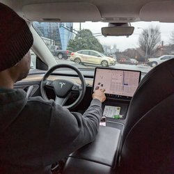 Uber - Tesla Uber this morning in Midtown. At 10th Street Bridge next to McCamish Pavilion.