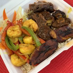 1Luv Island Restaurant - Oxtail, curry shrimp, steam vegetables, plantains and rice and peace. Absolutely delicious