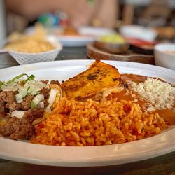 Tacos and Craft Peoria - Carne Asada taco and Quesabirria taco with rice and beans.