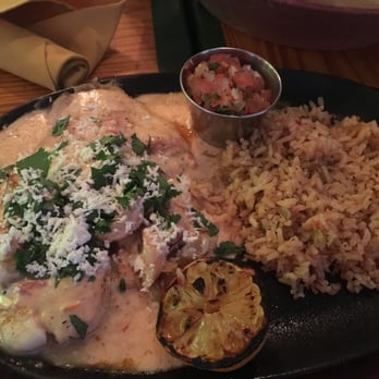 Lupe Tortilla Mexican Restaurant - Tilapia Veracruz8 oz. filet topped con grilled shrimp, roasted chile cream sauce, tomatoes, cilantro y queso fresco. - Mexican Near Me - Webster, Texas Lupe Tortilla Mexican Restaurant - Tilapia Veracruz8 oz. filet topped con grilled shrimp, roasted chile cream sauce, tomatoes, cilantro y queso fresco. - Mexican Near Me - Webster, Texas