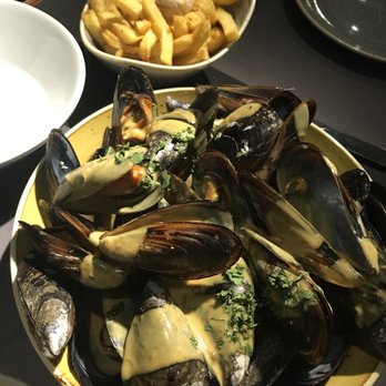 Juana la Loca - Mussels in curry sauce - Tapas/Small Plates Near Me - Madrid, M Juana la Loca - Mussels in curry sauce - Tapas/Small Plates Near Me - Madrid, M