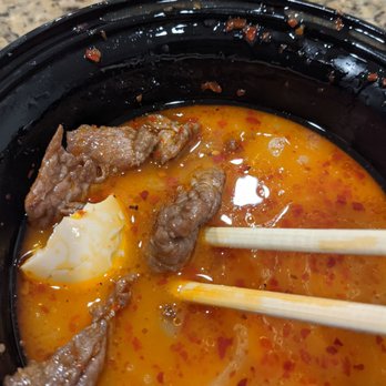 NoRa Asian Fresh - Ton of beef and a boiled egg in my spicy beef ramen broth (delish) - Sushi Bars Near Me - Peoria, Arizona