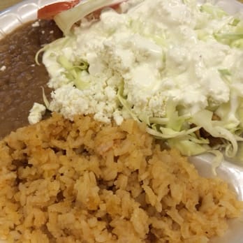 Delicia's Taqueria - Under that mass amount of mess is some yummie chicken flautas - Mexican Near Me - Salinas, California