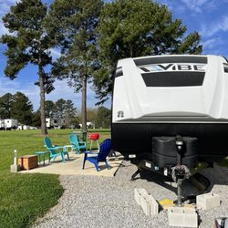 Bannister RV Park - Travel Trailer is on the gravel and we have a concrete slab as a patio and there is lots of grassy space to enjoy