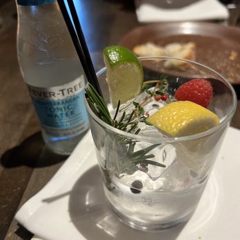 Crush - Botanical Gin & Tonic with raspberry, rosemary, lemon, lime, and juniper berries. - Lounges Near Me - Chico, California