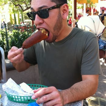 Corn Dog Castle - Enjoying his corndog ;) - Hot Dogs Near Me - Anaheim, California