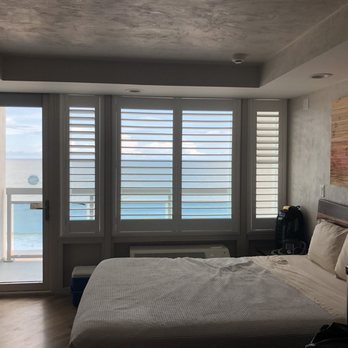 Georgian Inn Beach Club - Bed and the view. - Resorts Near Me - Ormond Beach, Florida Georgian Inn Beach Club - Bed and the view. - Resorts Near Me - Ormond Beach, Florida