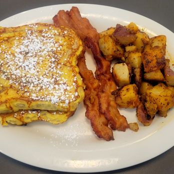 Eggs Up Grill - Slices, Strips, & Spuds: Two slices of cinnamon swirl French toast, bacon, and home fries. - Breakfast & Brunch Near Me - Savannah, Georgia Eggs Up Grill - Slices, Strips, & Spuds: Two slices of cinnamon swirl French toast, bacon, and home fries. - Breakfast & Brunch Near Me - Savannah, Georgia