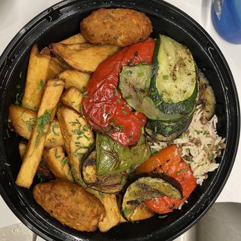 Mayrik - a bowl of food on a table - Mediterranean Near Me - Toronto, Ontario