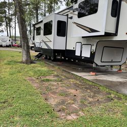Quality RV Resorts - "Premium" spot with broken flower pots, no picnic table and "landscaping"